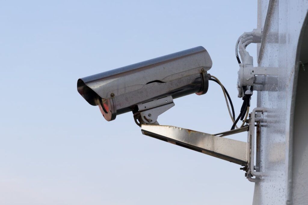 A CCTV (Closed-Circuit Television) system uses cameras to monitor and record activities in a designated area, offering real-time surveillance for security purposes. An IP CCTV system enhances this by transmitting video over a network, allowing remote monitoring and higher resolution video quality.